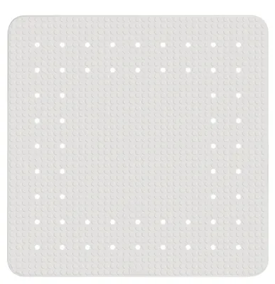 A white bath mat with a grid of small raised circles and a pattern of larger circular holes.