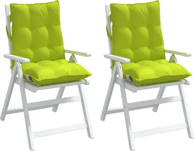 Two green chair cushions on white folding chairs.