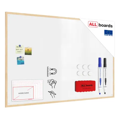 A whiteboard with accessories, including markers, magnets, and an eraser, displayed on a white background.