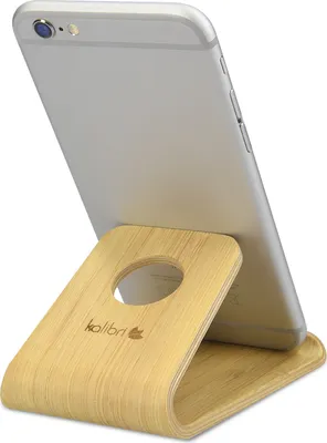 Produktbild von kalibri Handy Halterung Smartphone Ständer - Universal Halter kompatibel mit iPhone Samsung iPad Tablet u.a. - Tisch Stand Dock in Echtholz Hellbraun