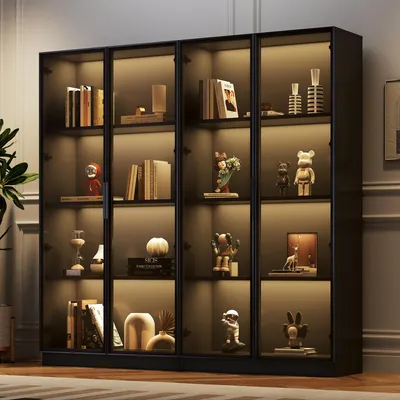 A well-lit display cabinet filled with various decorative items and books.
