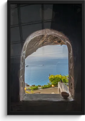 Produktbild von MuchoWow® MuchoWow® Gerahmtes Poster Blick auf das Meer durch ein Steinfenster 40x60 cm - Poster mit zchwarzem Bilderrahmen - Papierdruck - Wandbilder