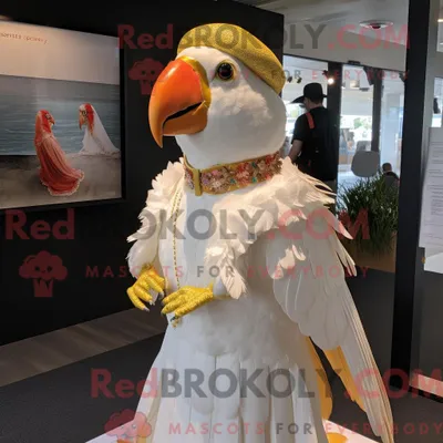 Produktbild von Maskottchen-Charakter REDBROKOLY eines goldenen Papageis mit Brautkleid und Baskenmütze