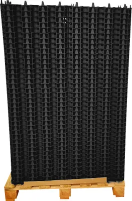 A stack of black plastic paddock plates on a wooden pallet.