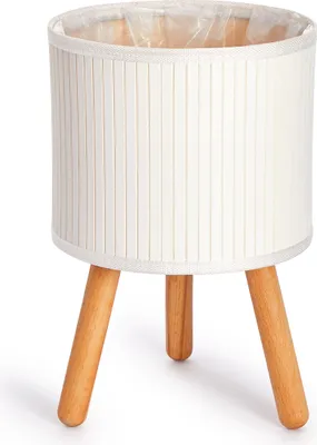A white bamboo planter with wooden legs on a white background.