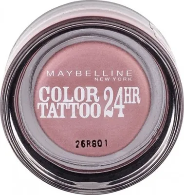 A top-down view of a small, round makeup pot with a clear lid.