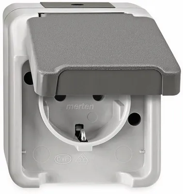 A close-up view of a white and gray MERTEN SCHUKO-Steckdose AQUASTAR electrical outlet with its protective cover open.