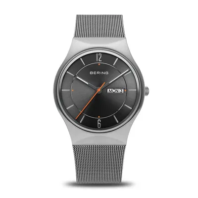 A Bering analog watch with a gray dial and a silver mesh strap, displayed on a white background.
