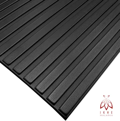 A close-up, angled view of black textured panels.