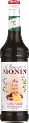 A bottle of Monin Chai Tea syrup.