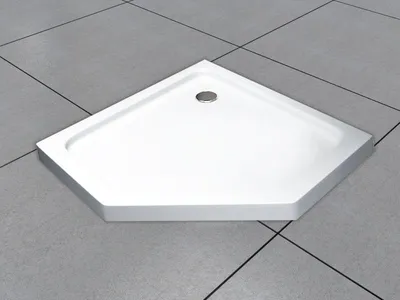 A white, pentagonal shower tray with a drain is placed on a gray tiled floor.