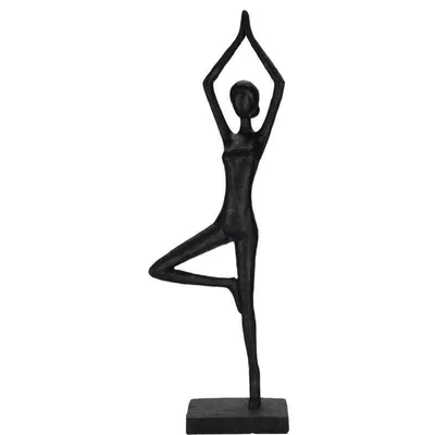 A black sculpture of a person in a yoga pose on a white background.