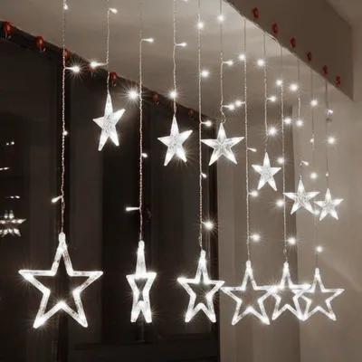 Immagine prodotto di Stelle di Natale appese a una tenda di ghiaccioli 4m 138 LED