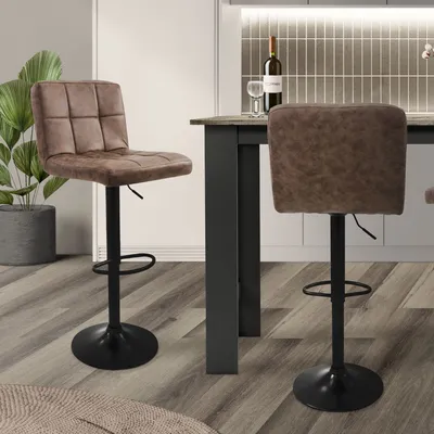 A kitchen or dining area with bar stools and a counter.