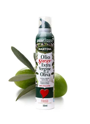 A spray bottle of olive oil is shown with two olives and olive leaves.