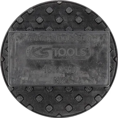 A close-up, top-down view of a black rubber pad with embossed diamond patterns and a central rectangular section containing text and a logo.