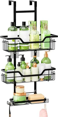 A black three-tiered shower caddy hanging over a shower door, filled with various bottles of toiletries and a bar of soap.