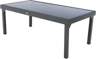 A rectangular outdoor dining table with a dark glass top and dark metal legs, shown against a white background.