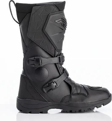 A black motorcycle boot is shown in a studio setting against a white background.