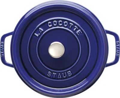A top-down view of a blue Staub cocotte pot.