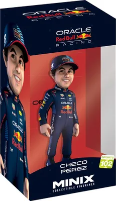 A collectible figurine of Checo Perez in his Red Bull Racing uniform, displayed in its packaging.