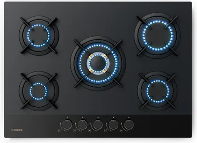 A top-down view of a black gas stovetop with five burners, four of which are lit with blue flames.