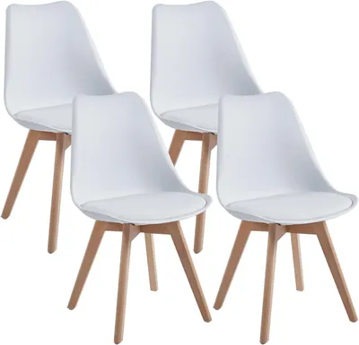 Four white chairs with wooden legs arranged in a group.