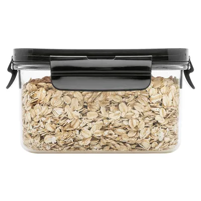 A clear, front-facing shot of a rectangular food storage container filled with oats.