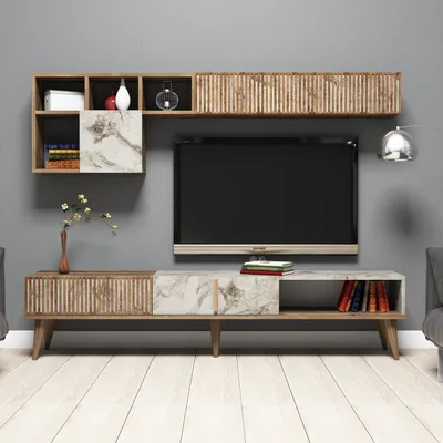A modern TV stand and shelving unit mounted on a gray wall.