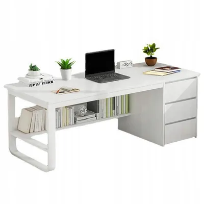 A white computer desk with shelves and drawers, decorated with plants and books.