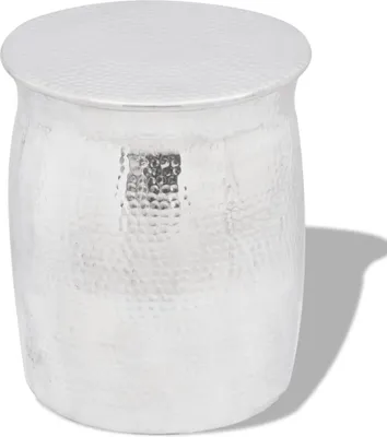 A silver, hammered aluminum side table or stool is shown against a white background.