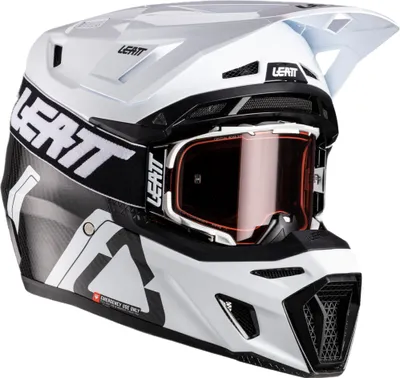 A white and black motocross helmet with orange tinted goggles, presented against a white background.