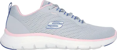 A side view of a single gray Skechers shoe with pink and blue accents.