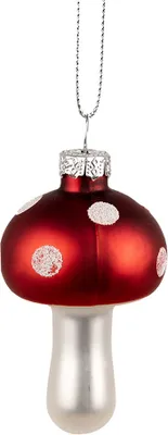 A Christmas ornament shaped like a red and white mushroom.