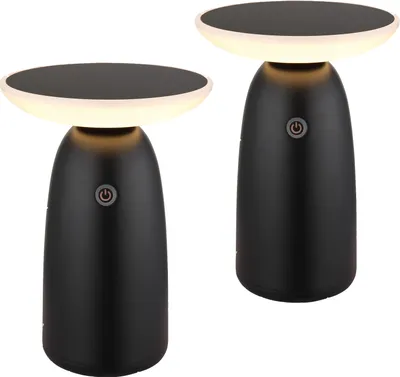 Two black table lamps with illuminated tops are shown against a white background.