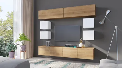 A modern living room with a wall-mounted entertainment unit, TV, and decorative items.