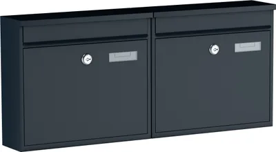A pair of dark gray mailboxes mounted side-by-side against a light gray background.