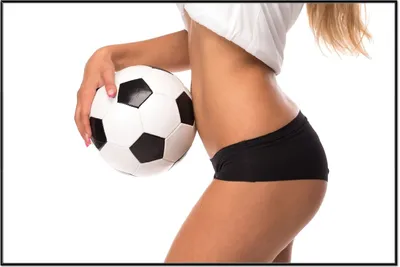 Produktbild von Wallario Wandbild Fußball - sexy Frau mit einem Fußball, Größe: 61 x 91,50 cm, Poster mit schwarzem Aluminiumrahmen