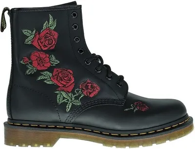 A black Dr. Martens boot with red rose embroidery.