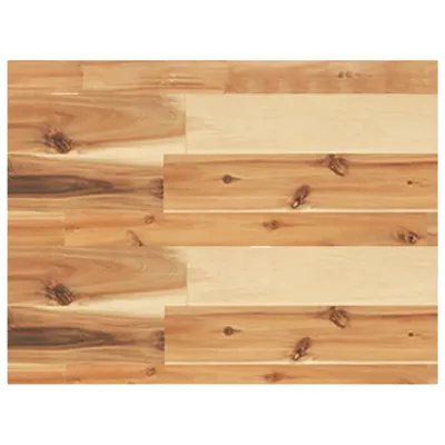 A close-up view of a wooden surface, likely a tabletop or flooring, with visible wood grain and knots.