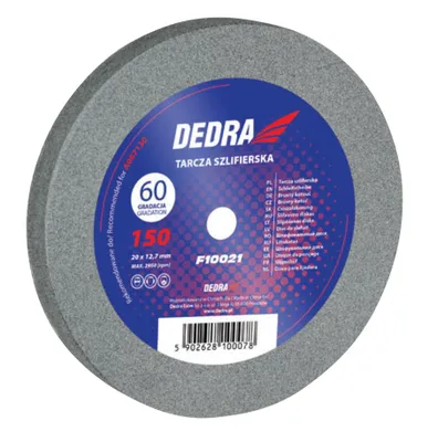 A close-up of a grinding wheel with product information on its label.