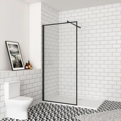 A modern bathroom with a walk-in shower, toilet, and patterned floor.
