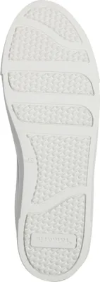 The sole of a white sneaker is shown from an underneath view.
