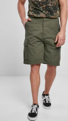 A man wearing olive cargo shorts and a camouflage t-shirt.