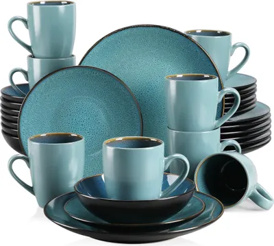 A collection of teal-colored ceramic dinnerware, including plates, bowls, and mugs, arranged on a white background.