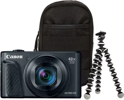A black Canon PowerShot SX740 HS camera is shown with a black carrying case and a flexible tripod.