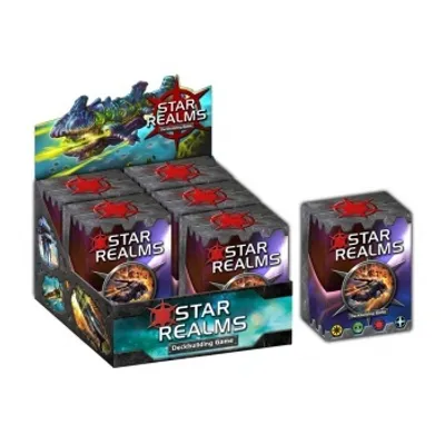 A display box of Star Realms deckbuilding game card packs, with one individual pack shown to the right.
