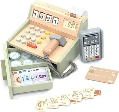 A wooden toy cash register with accessories, including play money, coins, a credit card, and a card reader, arranged on a white background.