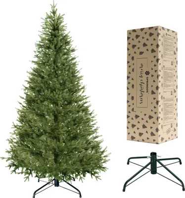 A Christmas tree, its packaging box, and a stand are displayed against a white background.