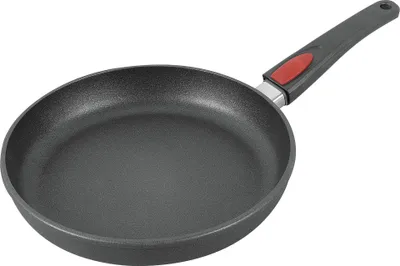 A black frying pan with a gray and red handle is shown against a white background.